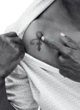 Chris-Rock-tatuaje-en-el-pecho